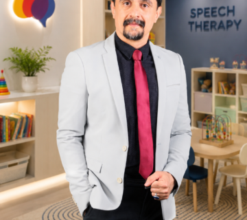 Two-Step Directions in Children | Dr. Azizreza Ghasemzadeh, Speech Therapist in Dubai standing in a speech therapy clinic