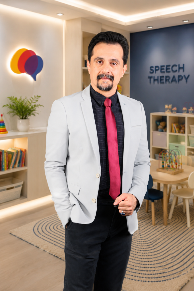 Two-Step Directions in Children | Dr. Azizreza Ghasemzadeh, Speech Therapist in Dubai standing in a speech therapy clinic